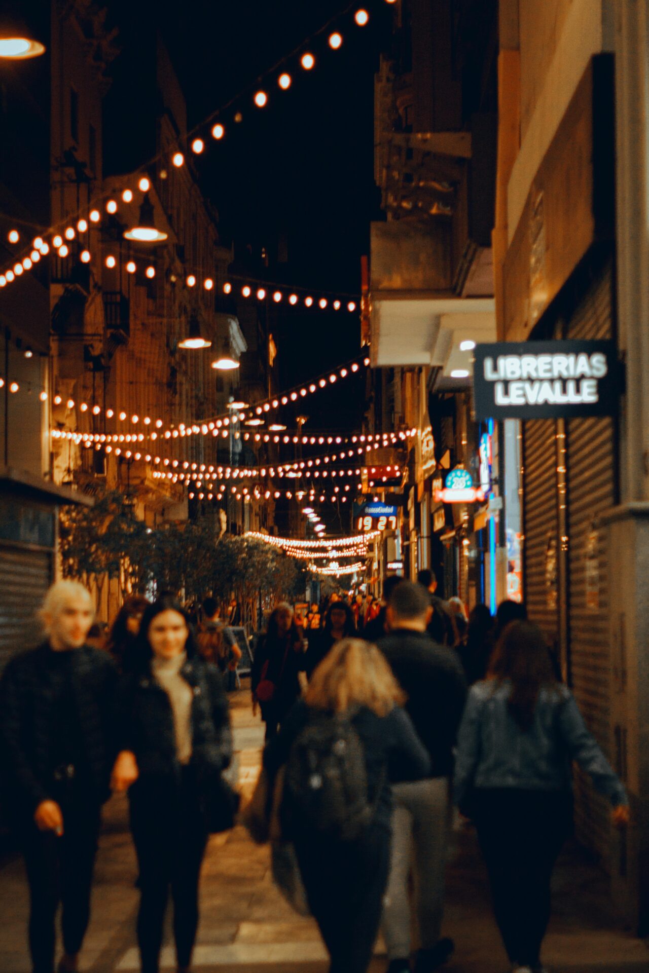 Capturing the bustling nightlife on Lavalle Street, Buenos Aires with vibrant city lights.